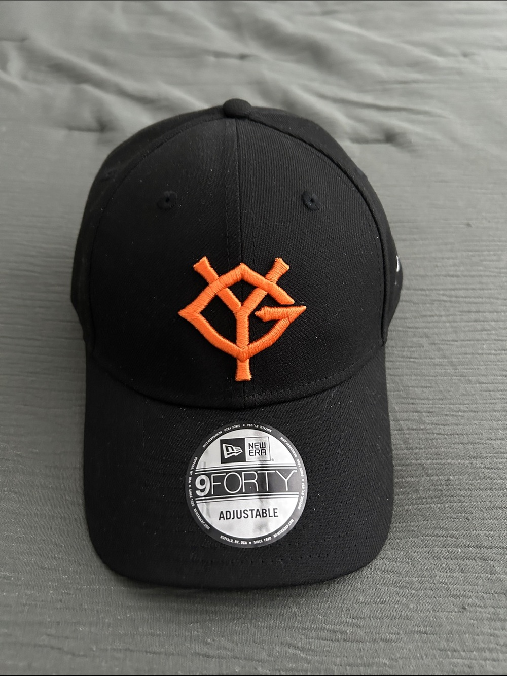 New Era Black Cap with Orange Embroidered Logo